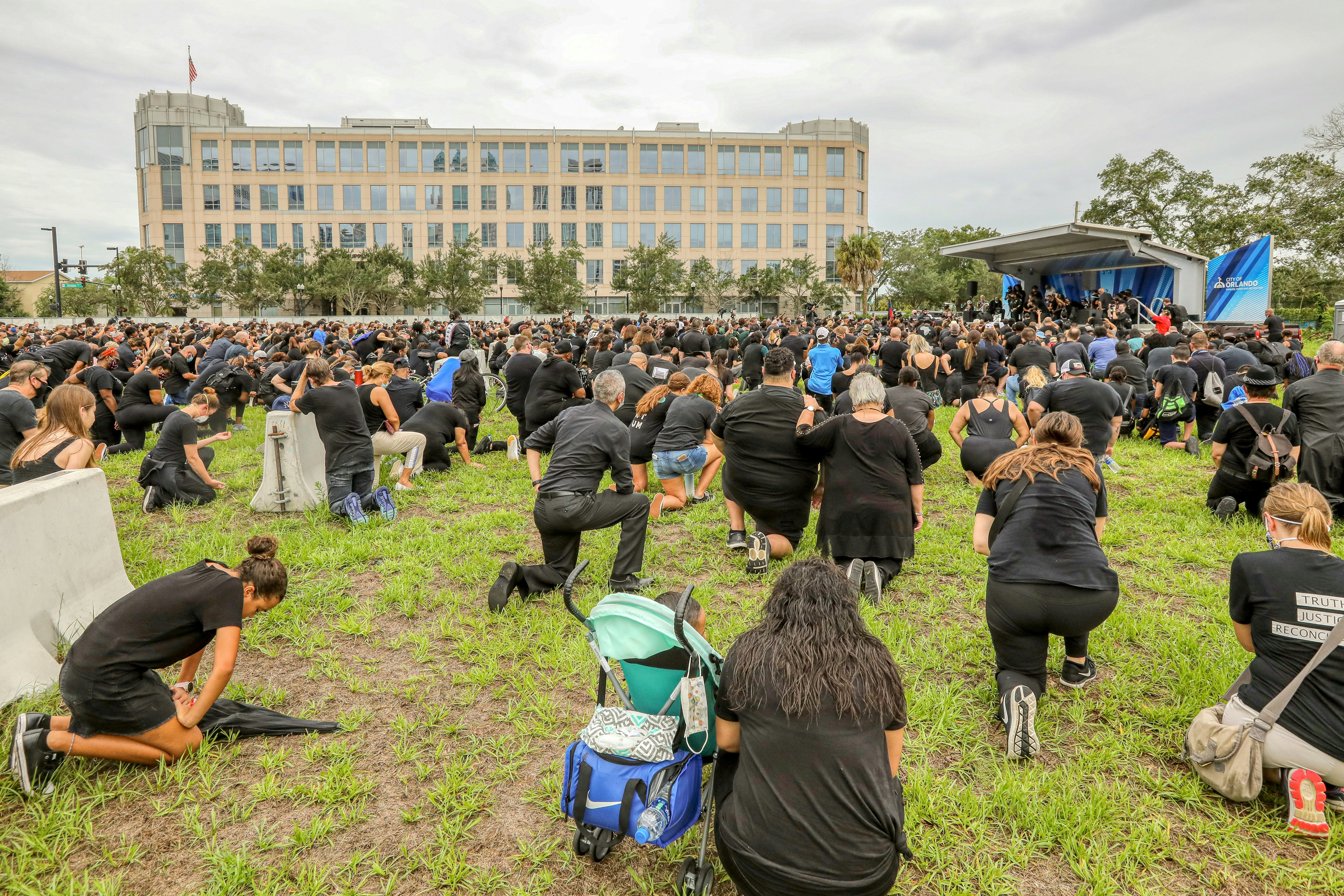 people sitting on green grass field during daytime